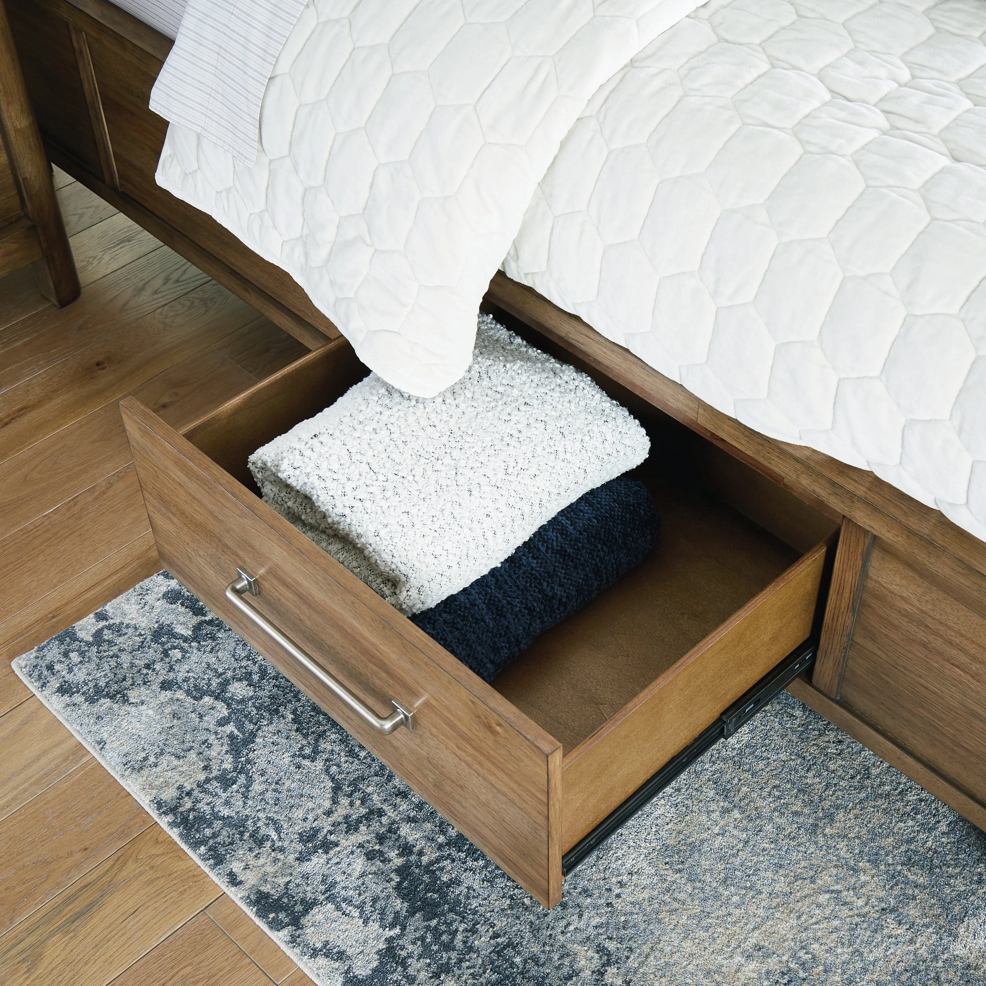 Cabalynn California King Panel Bed with Storage with Mirrored Dresser, Chest and Nightstand in Light Brown