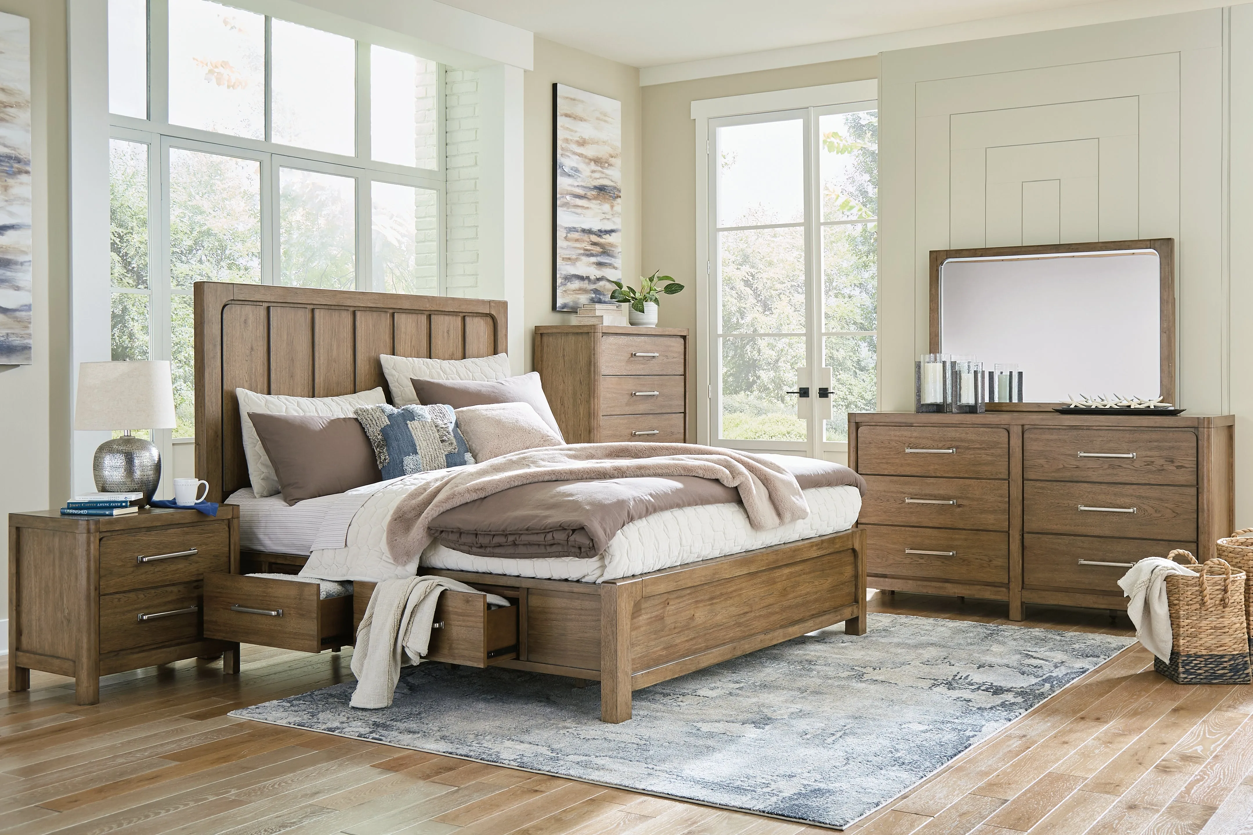 Cabalynn California King Panel Bed with Storage with Mirrored Dresser, Chest and Nightstand in Light Brown
