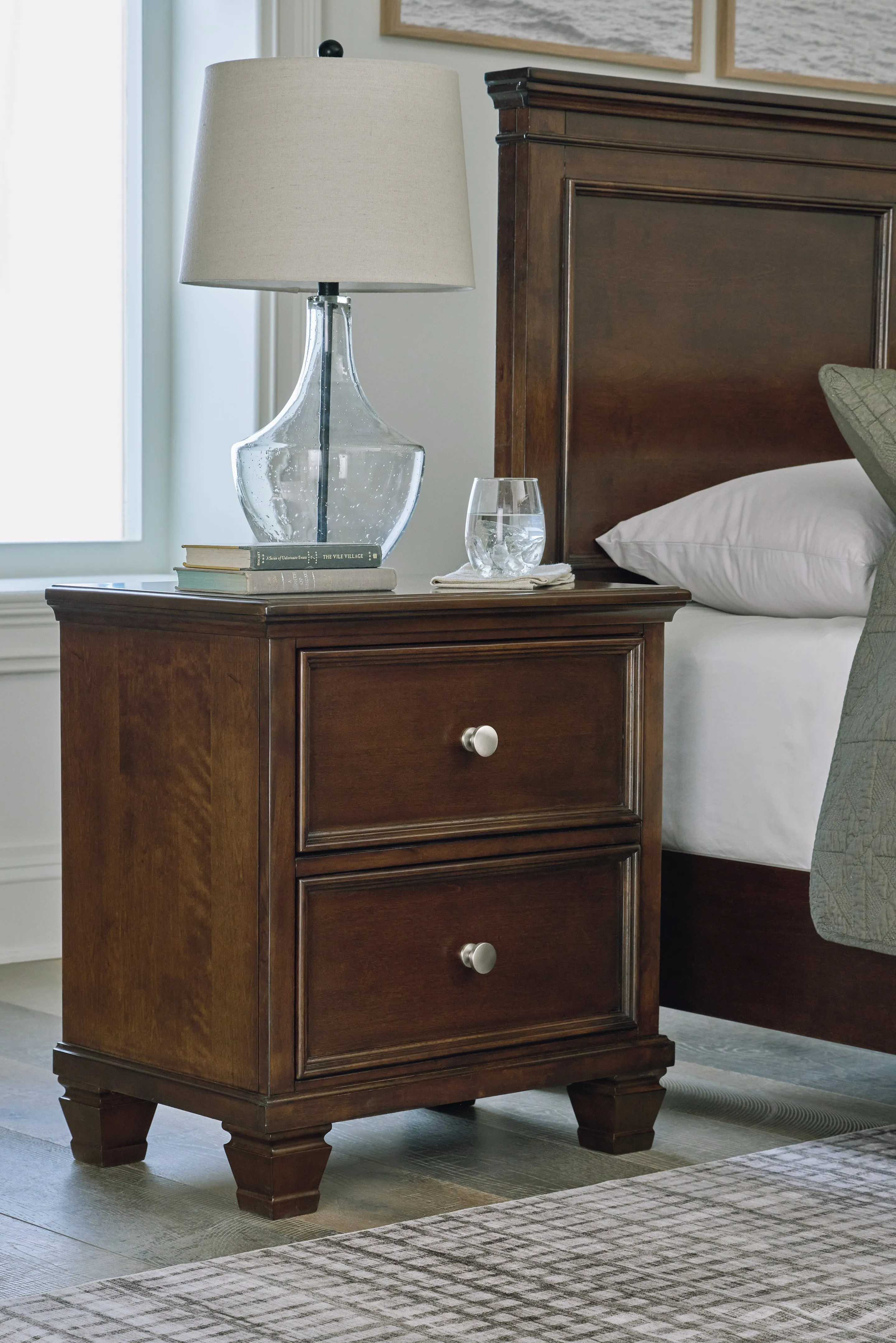 Danabrin King Panel Bed with Mirrored Dresser and Nightstand in Brown